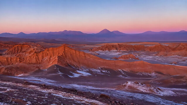 Valle de la Luna Red Sandstone Ridges and Volcanic Mountains at Dusk in Atacama Desert Chile