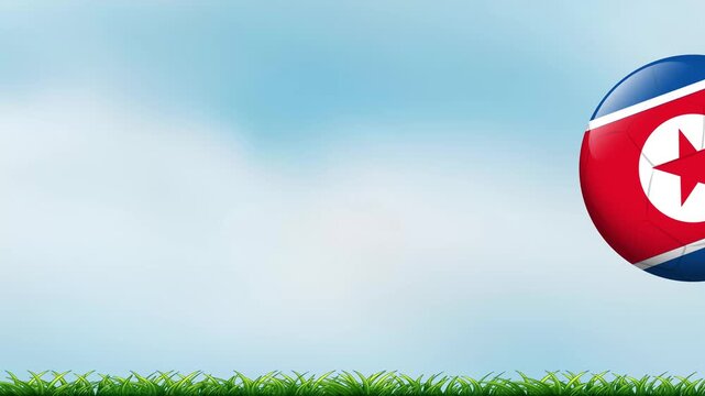 Bouncing Soccer Ball with North Korean Flag Pattern on Grass Field