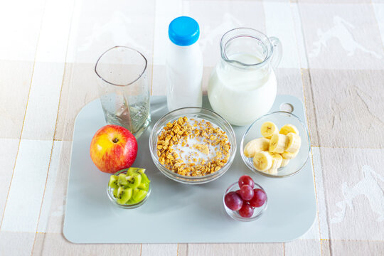 Healthy breakfast - muesli, fruits and dairy products on the table.