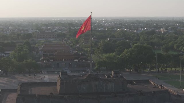 Aerial drone view of Hue Imperial Citadel featuring Ngo Mon Gate and Hue Flag Tower, showcasing Vietnam's UNESCO World Heritage site with majestic royal architecture and historic fortress.