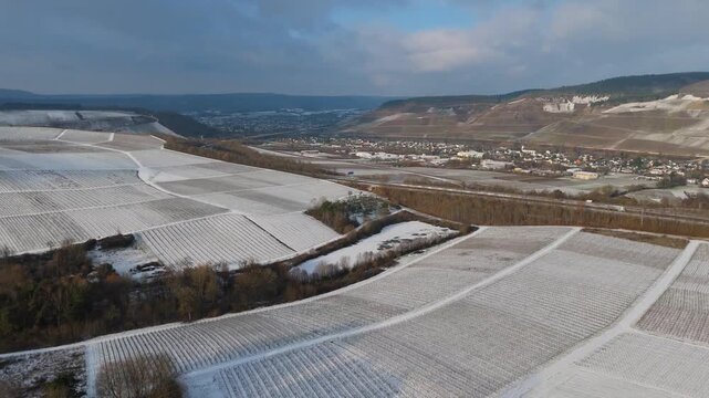 Moselle valley, winter season, snow and frost covered vineyard and river landscape near Trier, Germany, aerial view