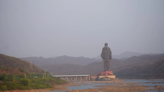 Scenic view of the Statue of Unity at Ekta Nagar, Kevadia, Gujarat, the world's tallest statue, highlighting tourism, history, monumental architecture, a river landscape and India's national heritage.