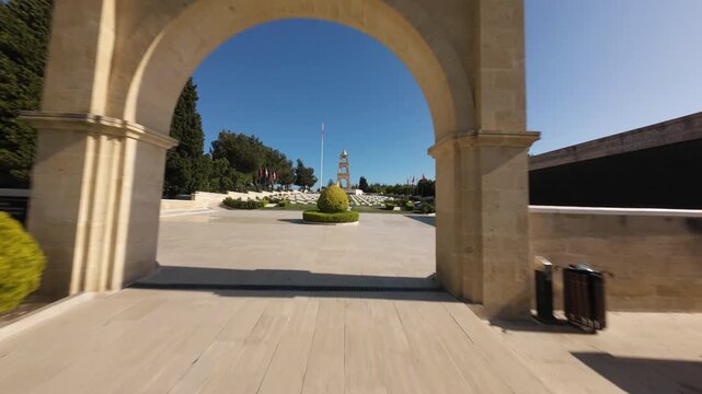 Scenic aerial shot slowly rotating over the Canakkale Martyrs' Memorial in Turkey's forest landscape, oe01