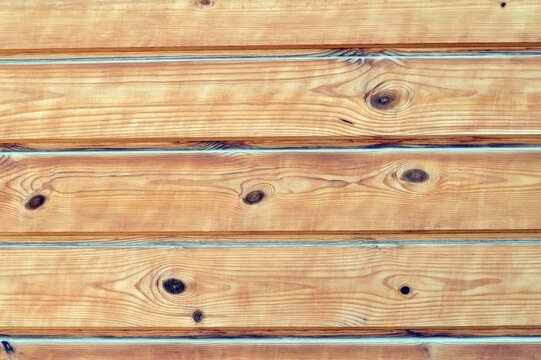 Light pine wooden boards with natural knots and smooth grain. Clean wood texture ideal for interiors, architecture, construction, Scandinavian design and graphic backgrounds.