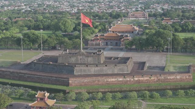 Aerial drone view of Hue Imperial Citadel featuring Ngo Mon Gate and Hue Flag Tower, showcasing Vietnam's UNESCO World Heritage site with majestic royal architecture and historic fortress.