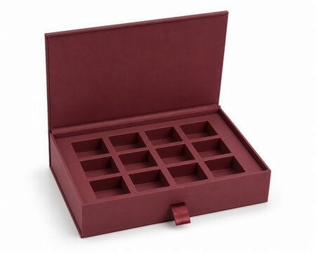 Open burgundy premium gift box with twelve square inner compartments and a ribbon tab. Elegant packaging mockup for luxury chocolates, truffles, or jewelry, isolated on white.