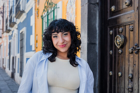 young latina woman smiling outdoors in Mexico Latin America, hispanic and mexican female portrait