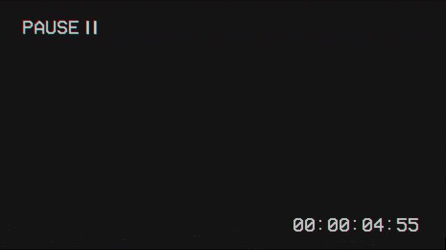 Retro vhs pause screen display with digital timecode on black