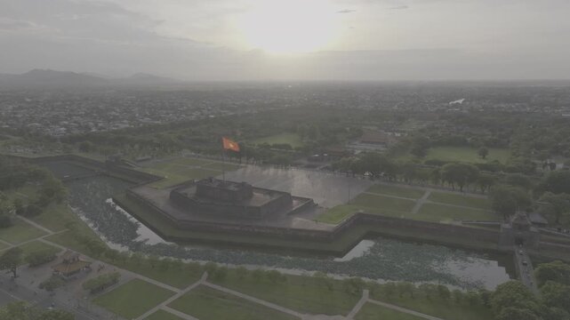 Aerial drone view of Hue Imperial Citadel featuring Ngo Mon Gate and Hue Flag Tower, showcasing Vietnam's UNESCO World Heritage site with majestic royal architecture and historic fortress.