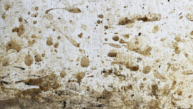 White wall surface covered with dried mud splatters