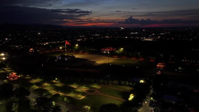 Aerial drone view of Hue Imperial Citadel featuring Ngo Mon Gate and Hue Flag Tower, showcasing Vietnam's UNESCO World Heritage site with majestic royal architecture and historic fortress.