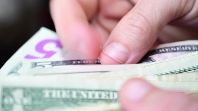 counting cash  wallet close up, selective focus up close cash money, finances concept