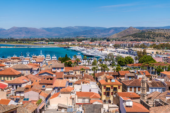 A view from the Acronauplia, fortress up over rooftops towards the marina in the old town in Nafplio in Greece in early summertime