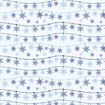 Light blue Christmas seamless pattern with snowflake garlands on frosty background