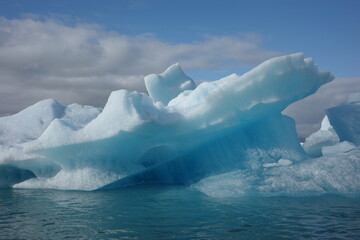 Blue iceberg floating in a glacial lagoon in Iceland © Bianca