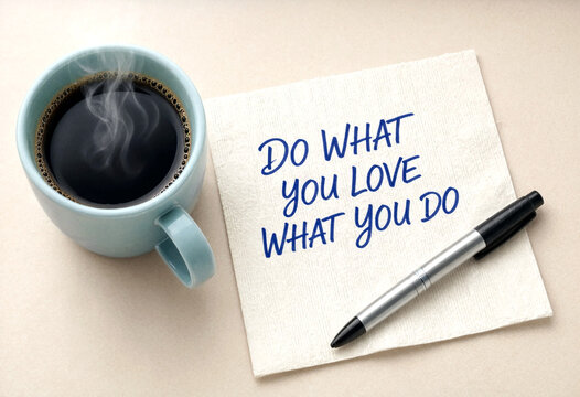 Handwritten motivational note with a hot cup of coffee and pen on table