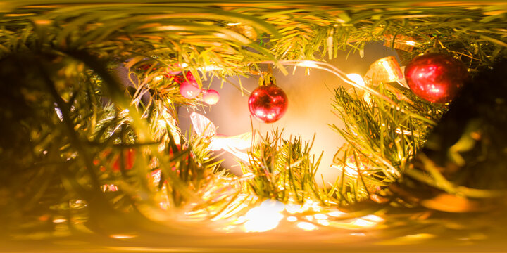 Seamless 360-Degree Panorama Inside Christmas Tree with Red Baubles and Glowing String Lights from Tree Interior Perspective