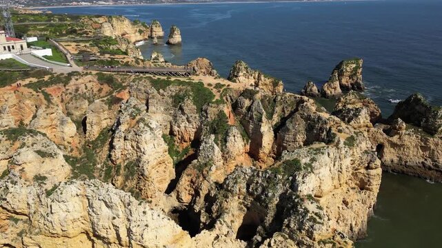 Drone Aerial View of Ponta da Piedade Coastline in Lagos, Algarve, Portugal on a Summer Day