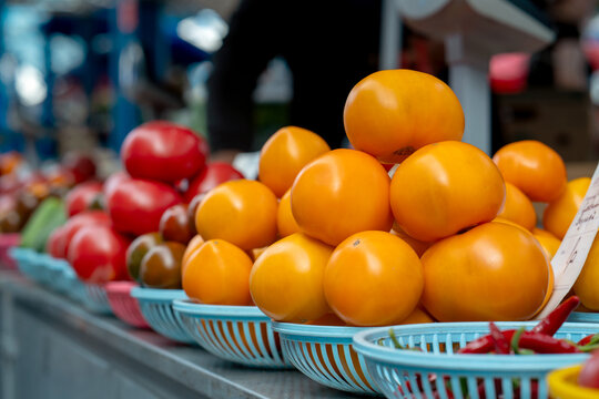 Multicolored tomatoes on a market stall. Farmers market.