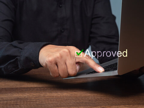 Business approval interface on laptop for digital workflow