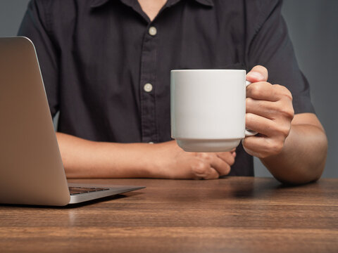 Coffee break at laptop during business work session