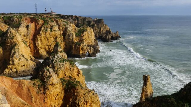 View of Ponta da Piedade Coastline in Lagos, Algarve, Portugal with Golden Cliffs and Atlantic Ocean