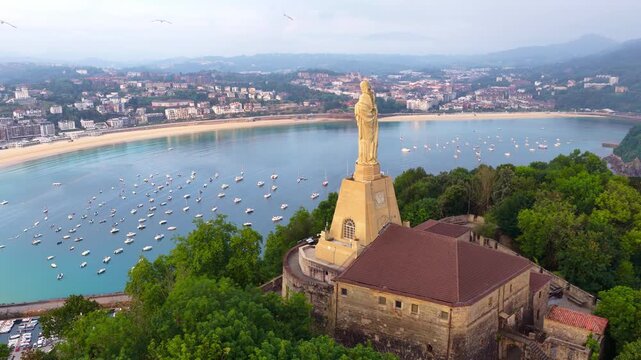 San Sebasti&aacute;n, a Spanish city, capital of Basque Country in Northern Spain, aerial view of San Sebasti&aacute;n harbor with a statue of Jesus Christ on a hill, tourism in San Sebasti&aacute;n, Spain
