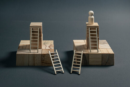Career success concept with a professional reaching the top of the career ladder