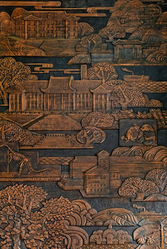 a traditional Chinese relief wall art piece, to depict landscapes and cultural motifs