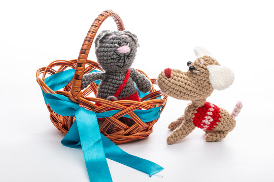Knitted wool cats and dogs on a white background