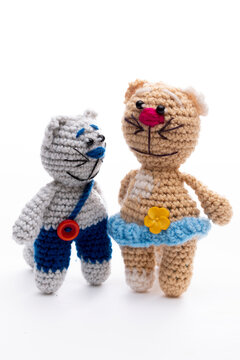 Knitted wool cats and dogs on a white background