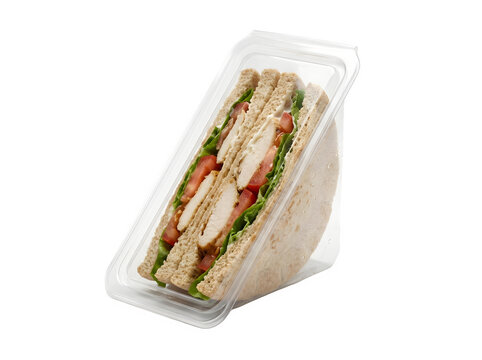 A triangular chicken sandwich with lettuce and tomato inside a clear plastic retail packaging box isolated on a white background, for sale isolated on a transparent background