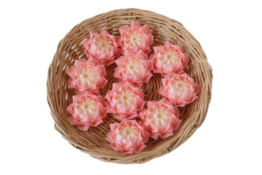 Handmade craft Thai festival decoration,Coins wrapped in floral ribbons on a basket against a white background.