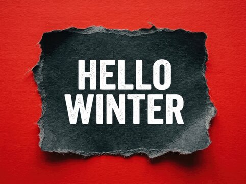 Hello Winter, bright white typography on torn black paper, announcing season's arrival on vivid red background.