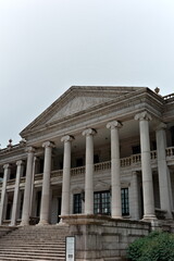 Ionic columns and ornate cornice of a neoclassical stone hall at Deoksugung Palace's Seokjojeon, Seoul, South Korea © knaknak