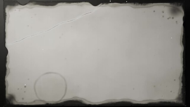 Cutting dark frame showing scalloped film centered, with ring mark, dust, crease, sliding leader