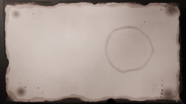 Unrolling entering top center, two rollers pulling parchment down at studio revealing ring stain