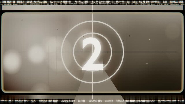 Cycling vintage countdown leader showing numerals and crosshair at projector gate, signaling start