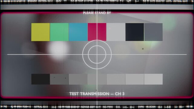 Playback starting, test card displaying on monitor for checks with magenta border, color bars