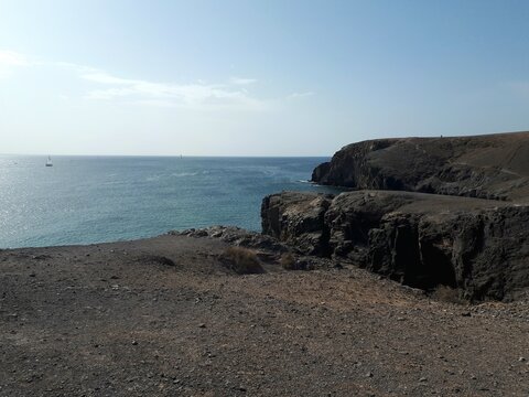 Volcanic cliffs overlooking the Atlantic Ocean in Lanzarote, Canary Islands, Spain
