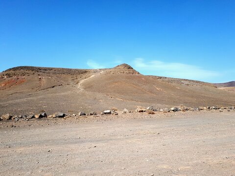Barren volcanic hills in the arid landscape of Lanzarote, Canary Islands, Spain