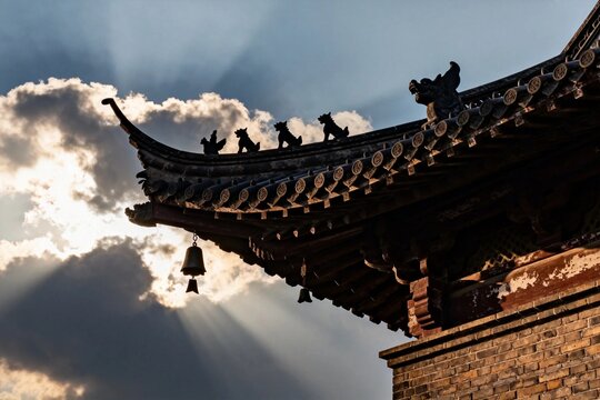 Traditional Chinese Roofline with Sunlight and Clouds
