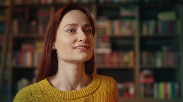 Nervous red-haired woman waiting for date who stood her up in urban library