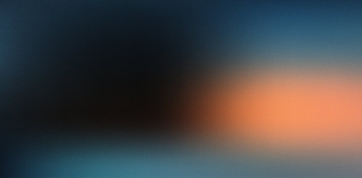 Beautiful dark abstract grainy gradient background with vibrant orange light