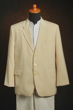 Men formal attire, suit or blazer with white trousers on display mannequin