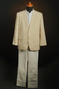 Men formal attire, suit or blazer with white trousers on display mannequin