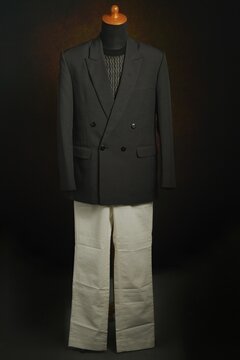 Men formal attire, suit or blazer with white trousers on display mannequin