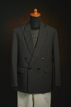 Men formal attire, suit or blazer with white trousers on display mannequin