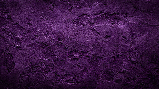 Dark textured purple background with rough surface for Halloween spooky themes and graphic design projects