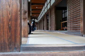 Obraz premium Tatami Corridor With Wood Pillars Inside Japanese Temple Building on Spring Day